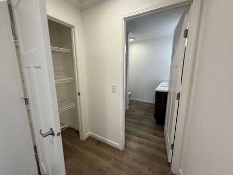 Hallway toward bath and closets